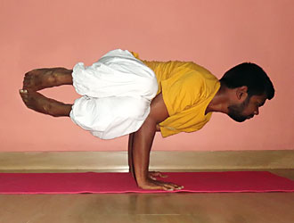 Parsva Bakasana Yoga Master Kannan at School of Santhi Yoga Teacher Training School in India